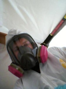 Water Damage Restoration Technician With Gas Mask