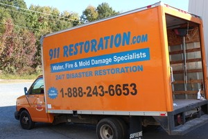 Water Damage Restoration Truck At Job Site