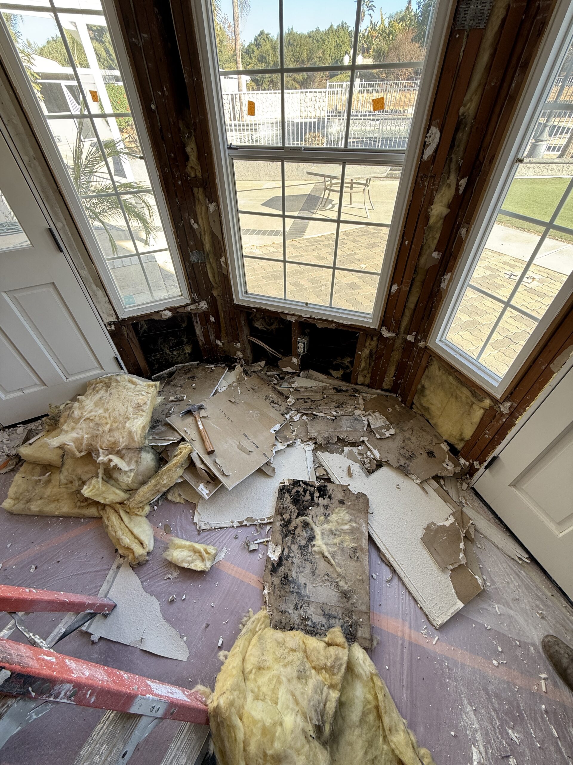 Mold remediation work in a Riverside home with affected drywall and insulation removed