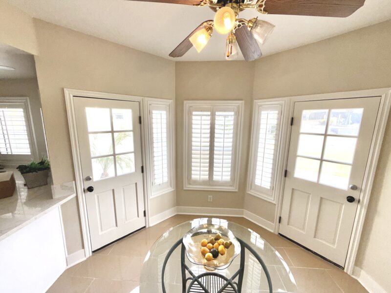 Completed home reconstruction with new flooring, painted walls, windows, and interior finishes