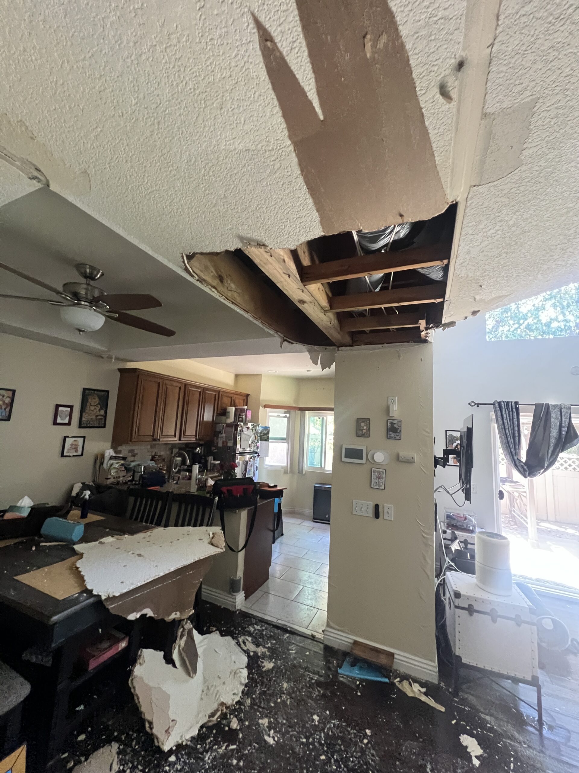 Water damage restoration in a Corona CA kitchen with ceiling materials removed
