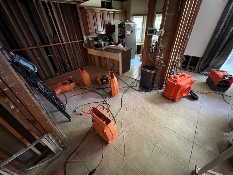 Air movers and drying equipment inside a Corona CA water damage project