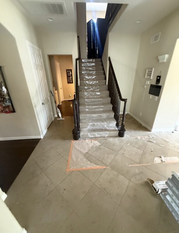 Water-damaged flooring before mitigation in a Corona California home