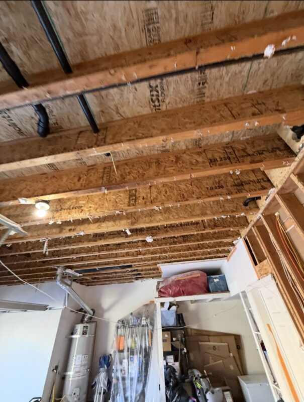 Exposed framing after water damage mitigation in Chino CA home
