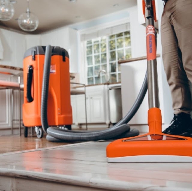 Professional water damage restoration equipment in a home